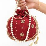 Gul-e-Zari: Inspired by the golden floral embroidery. Maroon Potli