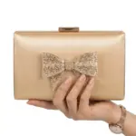 Elegance Shimmer Bow Clutch In Golden
